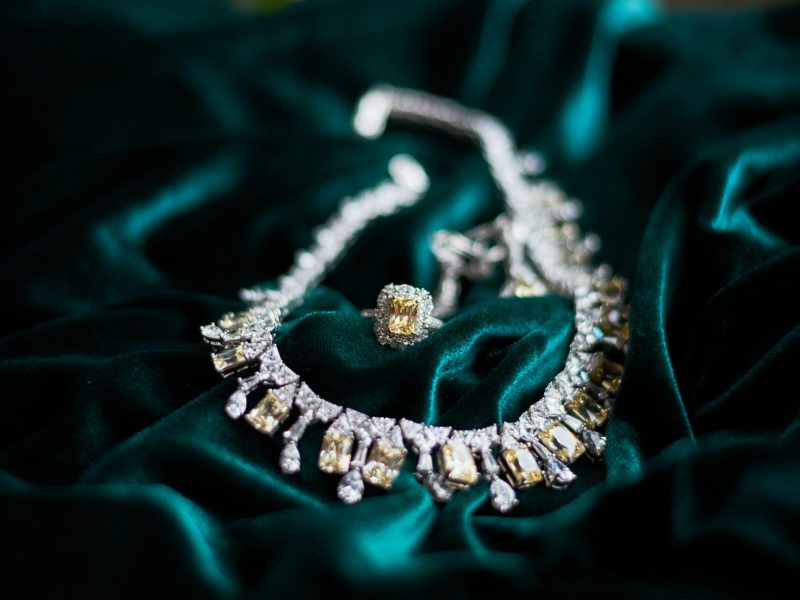 necklace brilliant on dark green velvet beckground yellow jewels necklace brilliant on dark green velvet